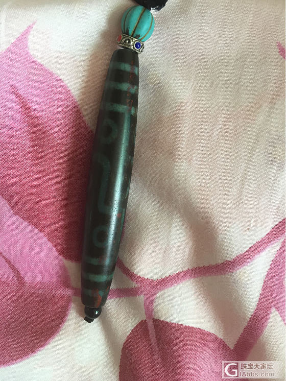 专家帮我看看这个九眼天珠是真的吗_天珠