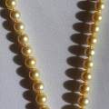 晒晒不就前收的南洋金珠项链一条，p9更新上身照，回复可见价格