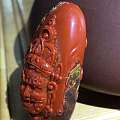 大凉山南红柿子红包浆石精心雕刻而成的《黄财神》