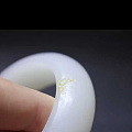 求各位朋友帮忙鉴定一下是不是资料皮色有无作假，价值多少