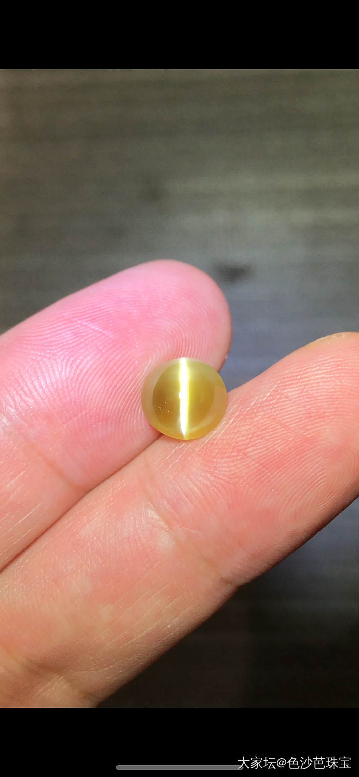 4.53克拉正圆形蜜糖金绿猫眼精品_名贵宝石
