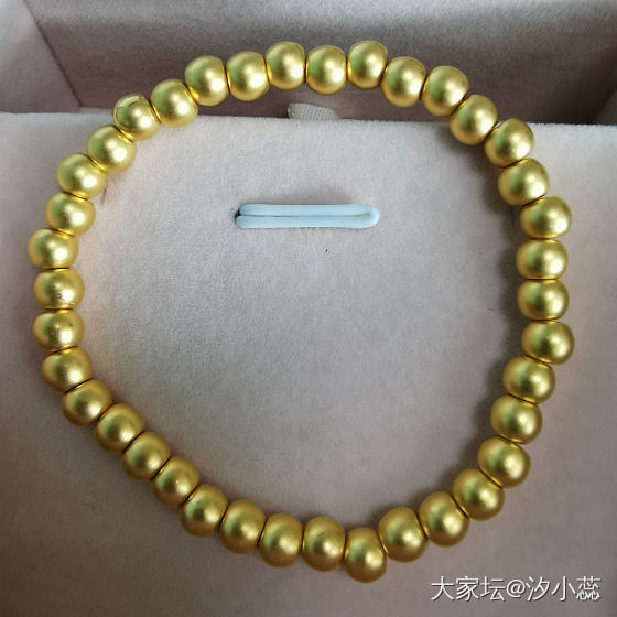 轻似薄纸硬如纲_珠串金