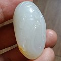 和田籽料关公---墨籽玉。
